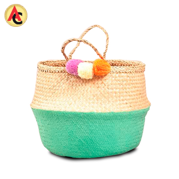 Seagrass basket decorated with pompoms