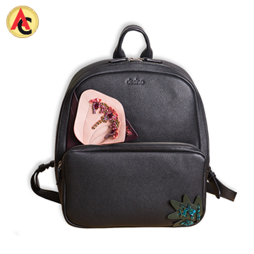 Leather backpack features beadwork