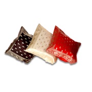 Pillow covers feature zari embroidery