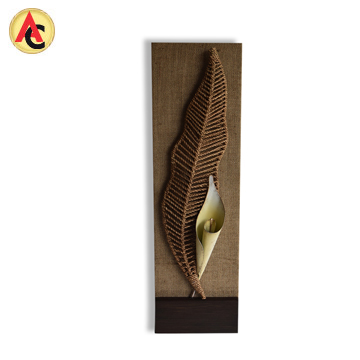 Mixed-media wall art features arum lily motif