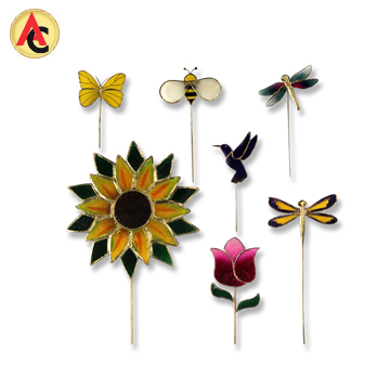 Decorative garden stakes crafted from capiz shell, metal