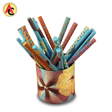 Paper pencil cup decorated with pressed flowers